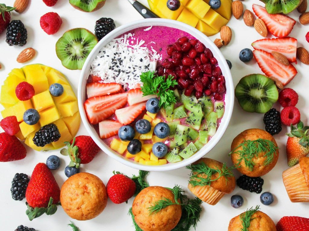 Colorful smoothie bowl with fresh fruit, highlighting lifestyle coaching and wellness by Dr. Pat at Health Team Network.